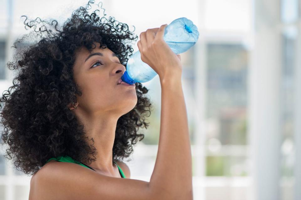 PHOTO: A woman is drinking more water for a new year's resolution seen in this stock image.  (STOCK PHOTO/Getty Images)