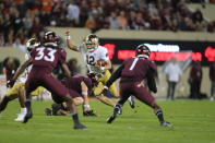 Notre Dame quarterback Tyler Buchner (12) runs the ball during the second half of an NCAA college football game against Virginia Tech in Blacksburg, Va., Saturday, Oct. 9, 2021. (AP Photo/Matt Gentry)