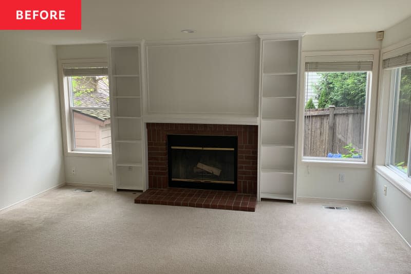 Fireplace in white living room before renovation.