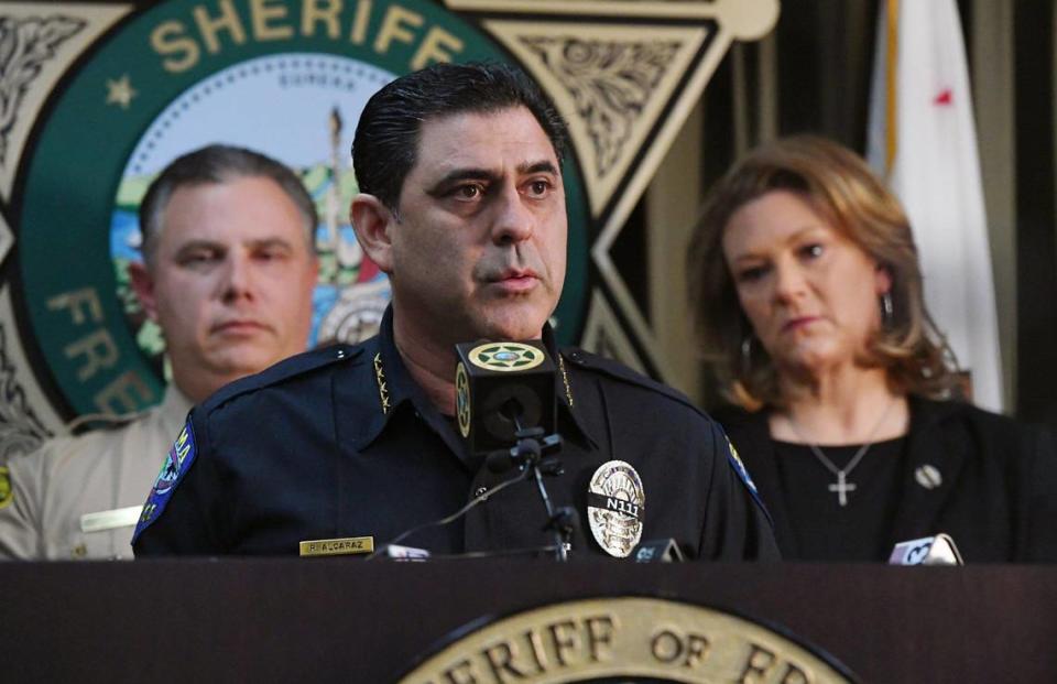 Selma Police Chief Rudy Alcaraz, center, flanked by Fresno Sheriff John Zanoni, left, and Fresno County District Attorney Lisa Smittcamp, right, releases an update on the killing of Selma police officer Gonzalo Carrasco Jr. at a press conference Friday, Feb 3, 2023 in Fresno.
