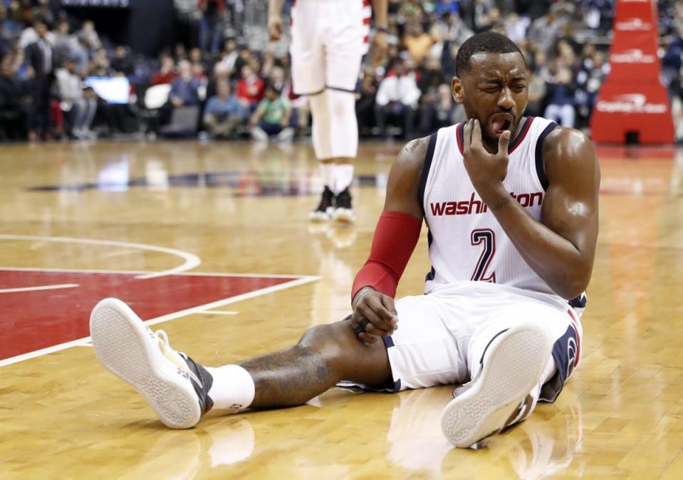 John Wall plays through the pain. (AP)