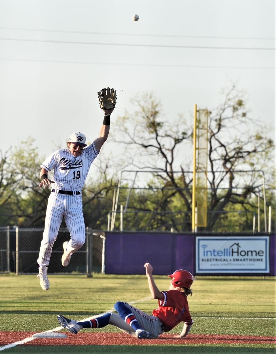 Brady Henderson steals third base as Wylie third baseman Sam Walker tries to snag a high throw from the catcher. Henderson scored on the error in the second inning.