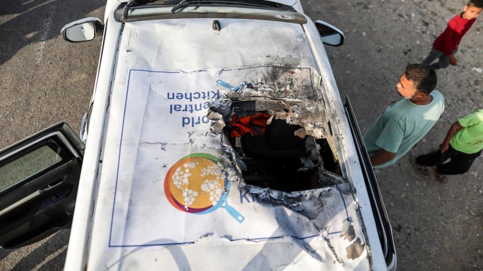 PHOTO: Residents inspect the damaged vehicle damaged vehicle carrying Western employees after the Israeli attack, April 2, 2024, in Deir al-Balah, Gaza. (Ali Jadallah/Anadolu via Getty Images)