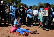 FILE PHOTO: Health workers carry placards as they protest during the coronavirus disease (COVID-19) outbreak in Harare