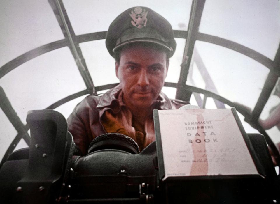 alan arkin wearing a navy hat and uniform in a submarine