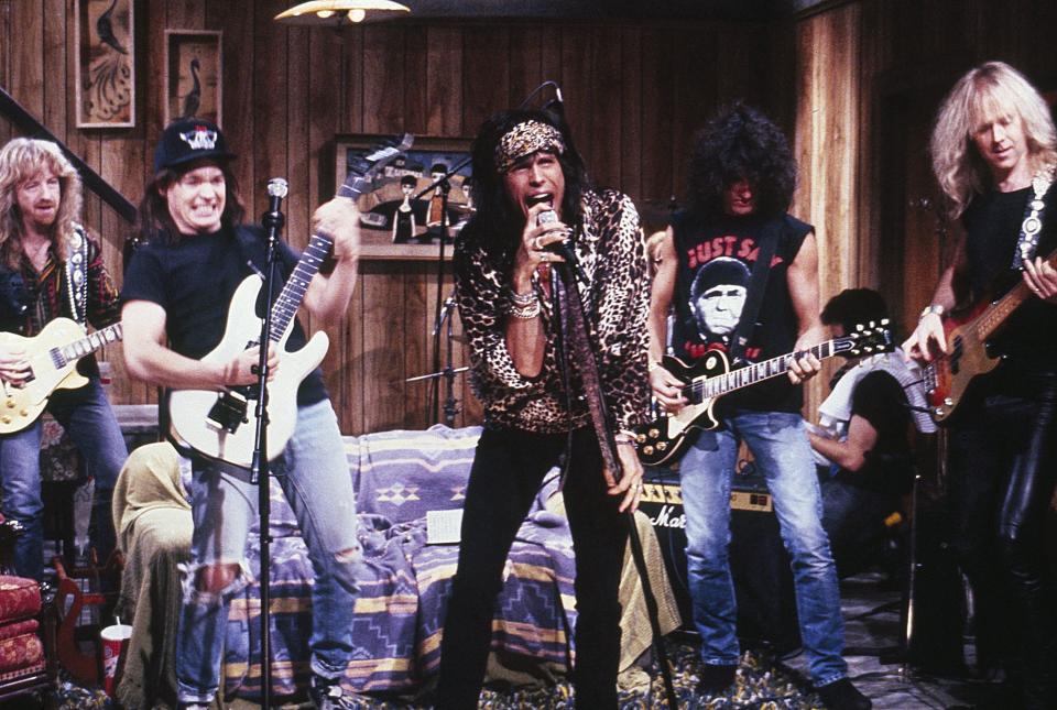 SATURDAY NIGHT LIVE -- Episode 13 -- Aired 02/17/1990 -- Pictured: (l-r) Brad Whitford, Mike Myers as Wayne Campbell, Steven Tyler, Joe Perry, Brad Whitford during the 