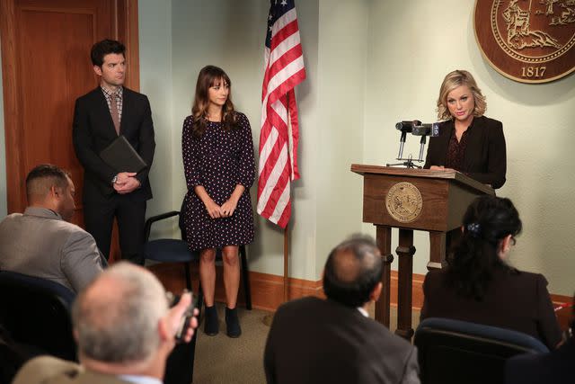 <p>Tyler Golden/NBCU Photo Bank/NBCUniversal via Getty</p> Adam Scott, Amy Poehler, Rashida Jones in season 6 of 'Parks and Recreation'