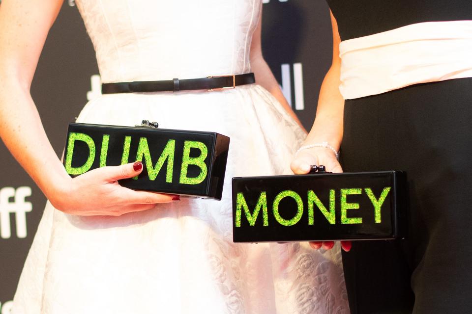 Executive producers/writers Rebecca Angelo (L) and Lauren Schuker Blum (detail bags) arrive for the premiere of "Dumb Money" during the Toronto International Film Festival at the Roy Thomson Hall in Toronto, Ontario, Canada, on September 8, 2023.