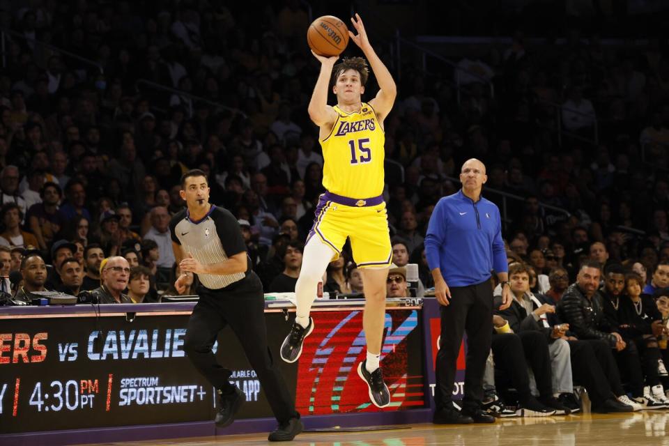 Lakers guard Austin Reaves launches a last second half-court shot, but is a tick too late to beat the buzzer