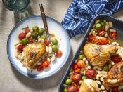 <p>This simple baked chicken packs a ton of flavor atop a nice, toasty mixture of beans, tomatoes, and herbs. Since the chicken cooks on top of the vegetables, its juice add to the sauciness of the burst, roasted tomatoes, the buttery olives, and the tender creamy beans. A little bit of lemon zest makes a lovely finish. The entire combination is just as satisfying as it is visually pleasing, especially faro or another grain. This dinner is easy but has a grown-up feel, and the combined ingredients are meant to be together. If you like, you can add in or substitute other olives or vegetables such as Brussels sprouts and onions—whatever fits your palate. </p> <p><a href="https://www.myrecipes.com/recipe/easy-roasted-chicken-breasts-tomatoes-white-beans" rel="nofollow noopener" target="_blank" data-ylk="slk:Easy Roasted Chicken Breasts with Tomatoes and White Beans Recipe;elm:context_link;itc:0;sec:content-canvas" class="link ">Easy Roasted Chicken Breasts with Tomatoes and White Beans Recipe</a></p>