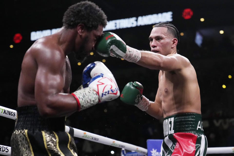 David Benavidez lands a left to Demetrius Andrade during a super middleweight boxing match Saturday, Nov. 25, 2023, in Las Vegas. (AP Photo/John Locher)