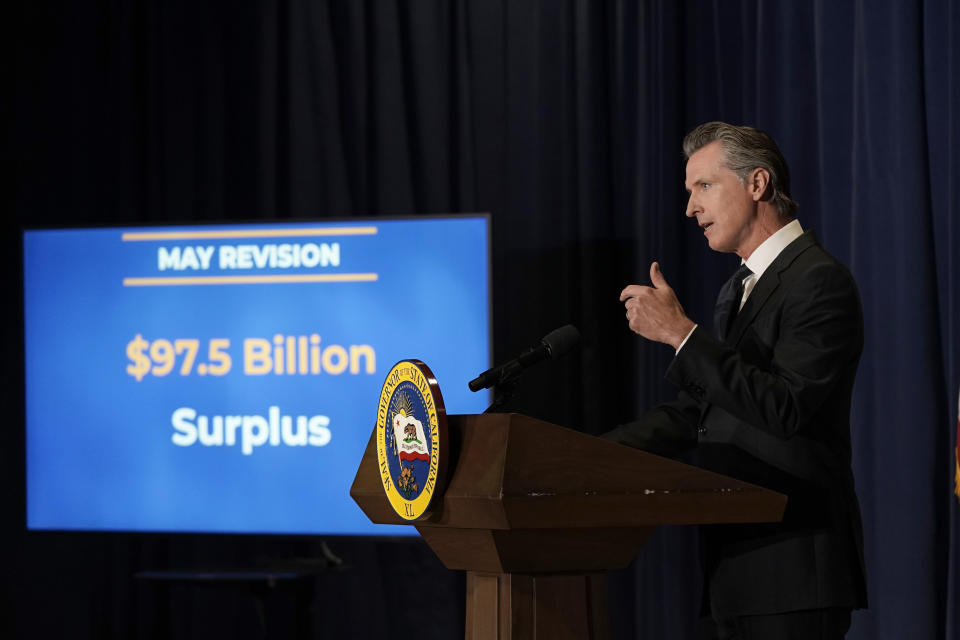 California Gov. Gavin Newsom unveils his 2022-2023 state budget revision during a news conference in Sacramento, Calif., Friday, May 13, 2022. California is expected have a record surplus. (AP Photo/Rich Pedroncelli,)