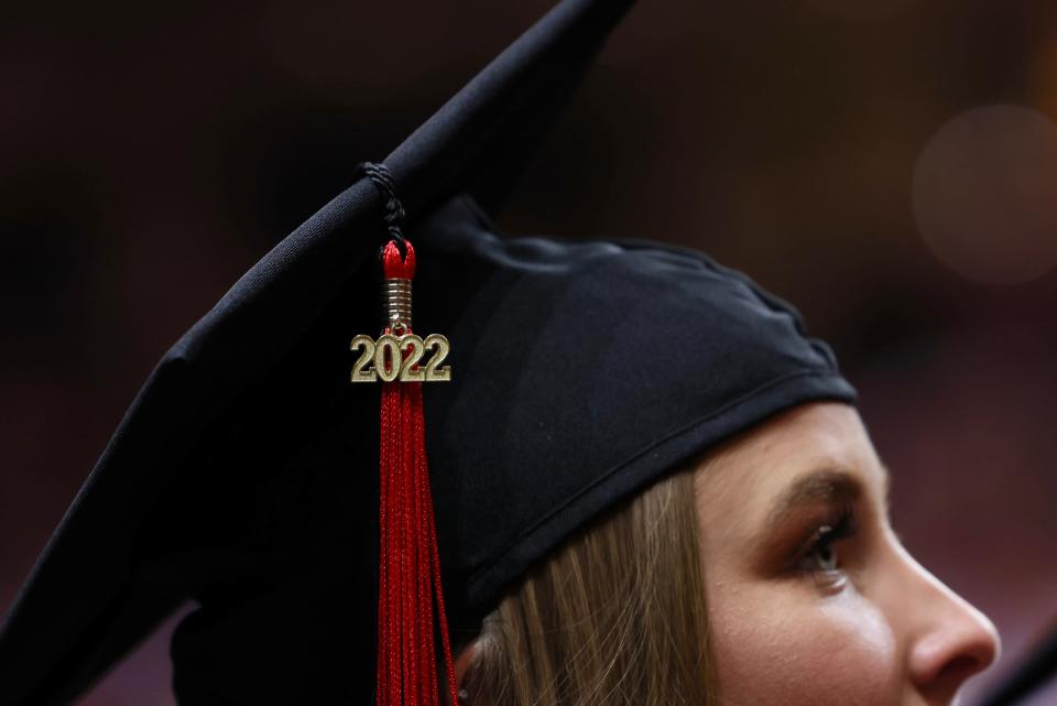 A graduating Texas Tech students looks on during the Friday afternoon commencement ceremony at the United Supermarkets Arena.