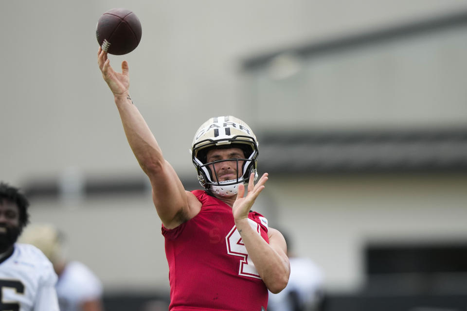 New Orleans Saints quarterback Derek Carr (4) passes during an NFL football practice in Metairie, La., Tuesday, June 6, 2023. (AP Photo/Gerald Herbert)