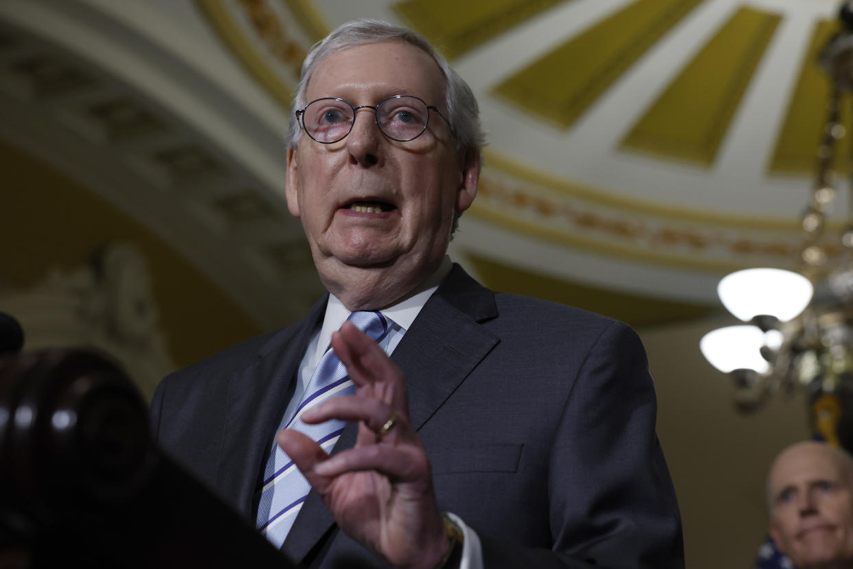 Sen. Mitch McConnell speaks under a dome in Congress.