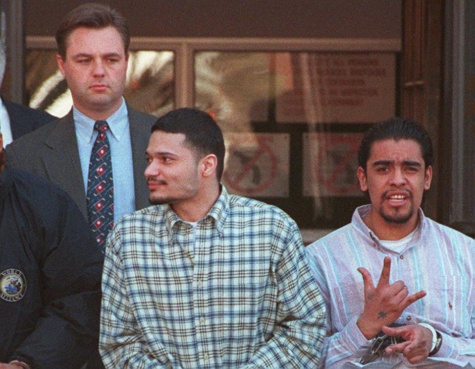 George Sepulveda, center, in a 1997 photo. Giovanni Lara is at right and an unidentified federal marshal is at left.