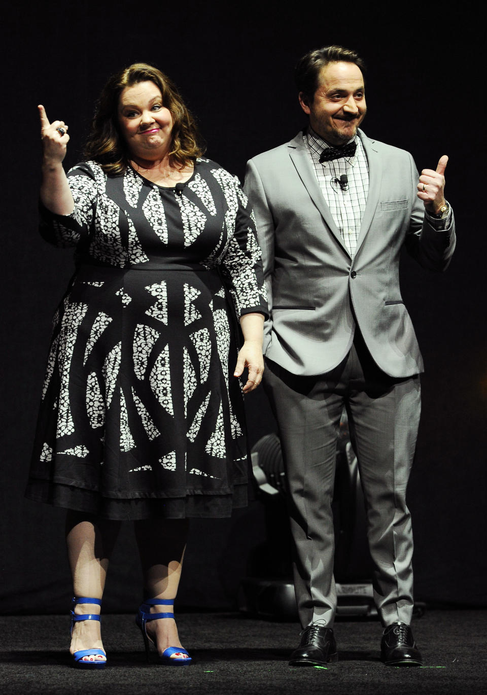 Melissa McCarthy, left, a cast member in the upcoming film "Tammy," and her husband Ben Falcone, writer and director of the film, address the audience during the Warner Bros. presentation at CinemaCon 2014 on Thursday, March 27, 2014, in Las Vegas. (Photo by Chris Pizzello/Invision/AP)