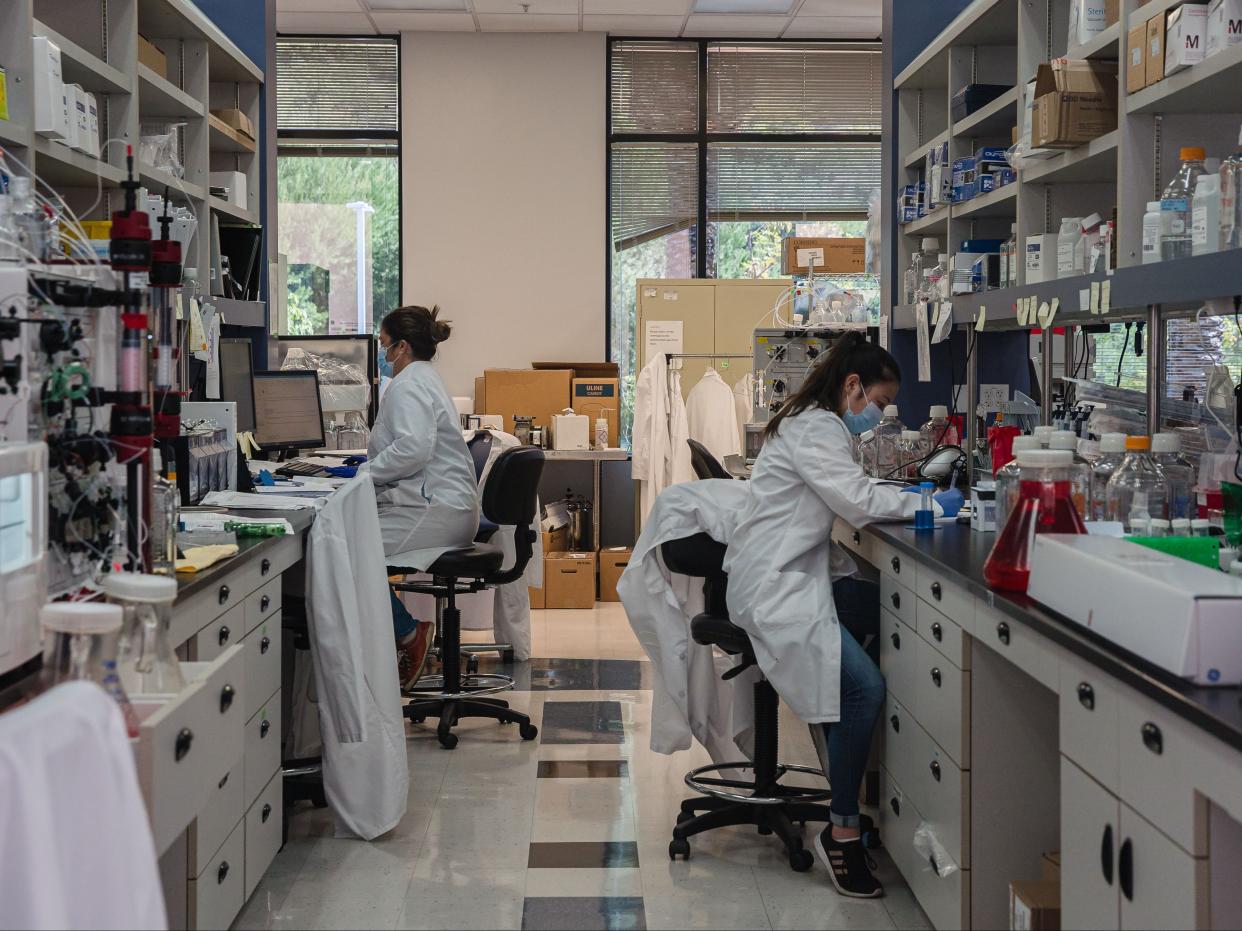 Employees working in a lab that is focused on fighting COVID-19 at Sorrento Therapeutics in San Diego, California on May 22, 2020. (AFP via Getty Images)