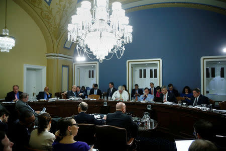 U.S. House Energy and Commerce Committee Chairman Representative Greg Walden (R-OR) (center L, at table) and Ways and Means Committee Chairman Representative Kevin Brady (R-TX) (center R, at table) testify at an early-morning Rules Committee hearing as Congress considers health care legislation to repeal Obamacare at the U.S. Capitol in Washington, U.S., March 24, 2017. REUTERS/Jonathan Ernst