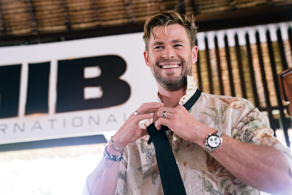 NUSA DUA, INDONESIA - MAY 27: Chris Hemsworth gives master class on how to tie the iconic MIB tie at "Men In Black: International" event at the St Regis Bali on May 27, 2019 in Nusa Dua, Indonesia. (Photo by Anthony Kwan/Getty Images for Sony Pictures Entertainment)