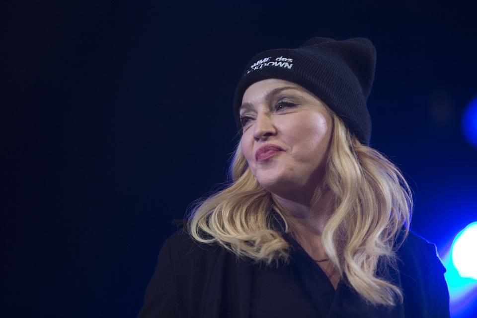 Madonna speaks before introducing Pussy Riot members Alyokhina and Tolokonnikova during the Amnesty International Bringing Human Rights Home concert in the Brooklyn borough of New York