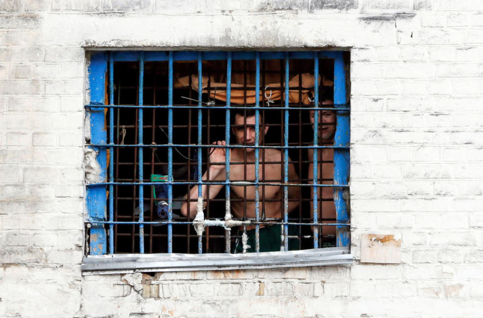 Detainees look out from prison cell in Kiev