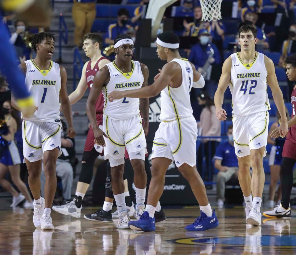 Delaware's (from left) Kevin Anderson, Ryan Allen, Jameer Nelson Jr. and Dylan Painter head to the bench as the game is decided late in the second half of the Blue Hens' 68-58 win against Lafayette at the Bob Carpenter Center, Wednesday, Dec. 8, 2021.