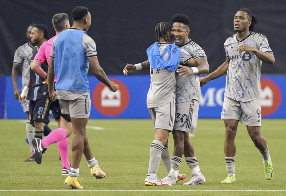 CF Montreal's Romell Quioto (30) celebrates with teammates after defeating the Philadelphia Union in an MLS soccer match in Montreal, Saturday, March 18, 2023. (Graham Hughes/The Canadian Press via AP)