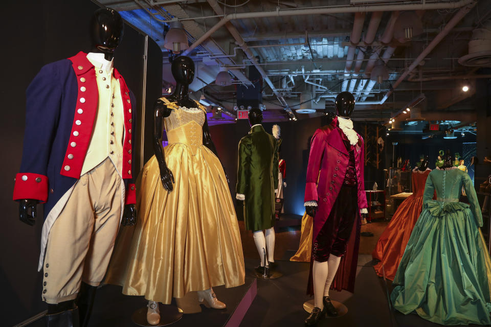 Costumes from the Broadway musical "Hamilton" are displayed at the "Showstoppers! Spectacular Costumes from Stage & Screen" exhibit, benefitting the Costume Industry Coalition Recovery Fund, in Times Square on Monday, Aug. 2, 2021, in New York. (Photo by Andy Kropa/Invision/AP)