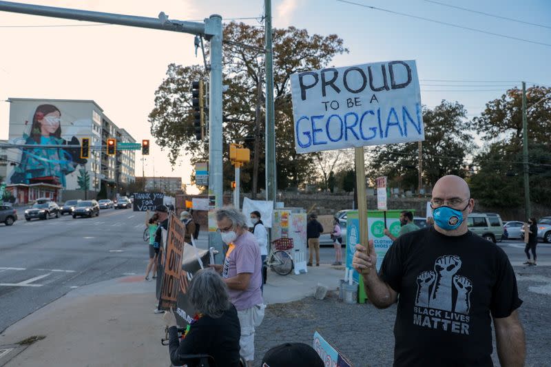 Protesters against U.S. President Donald Trump demonstrate at an intersection near Downtown in Atlanta