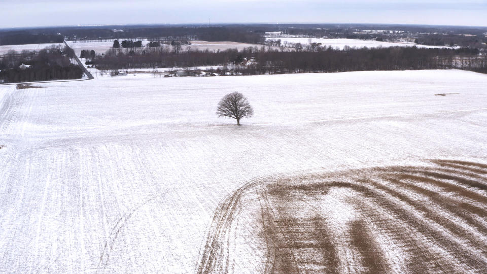 This undated aerial photo provided by Intel Corporation shows land in Licking County, Ohio, where Intel plans to build two new processor factories. Intel announced on Friday, Jan. 21, 2022, that it will invest $20 billion in the new computer chip facility in Ohio amid a global shortage of microprocessors used in everything from phones and cars to video games. Construction is expected to begin in late next year, with production coming online at the end of 2025. (Intel Corporation/ via AP)