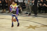 Devin Booker of the Phoenix Suns warms up before the NBA All-Star basketball game Sunday, Feb. 16, 2020, in Chicago. (AP Photo/David Banks)