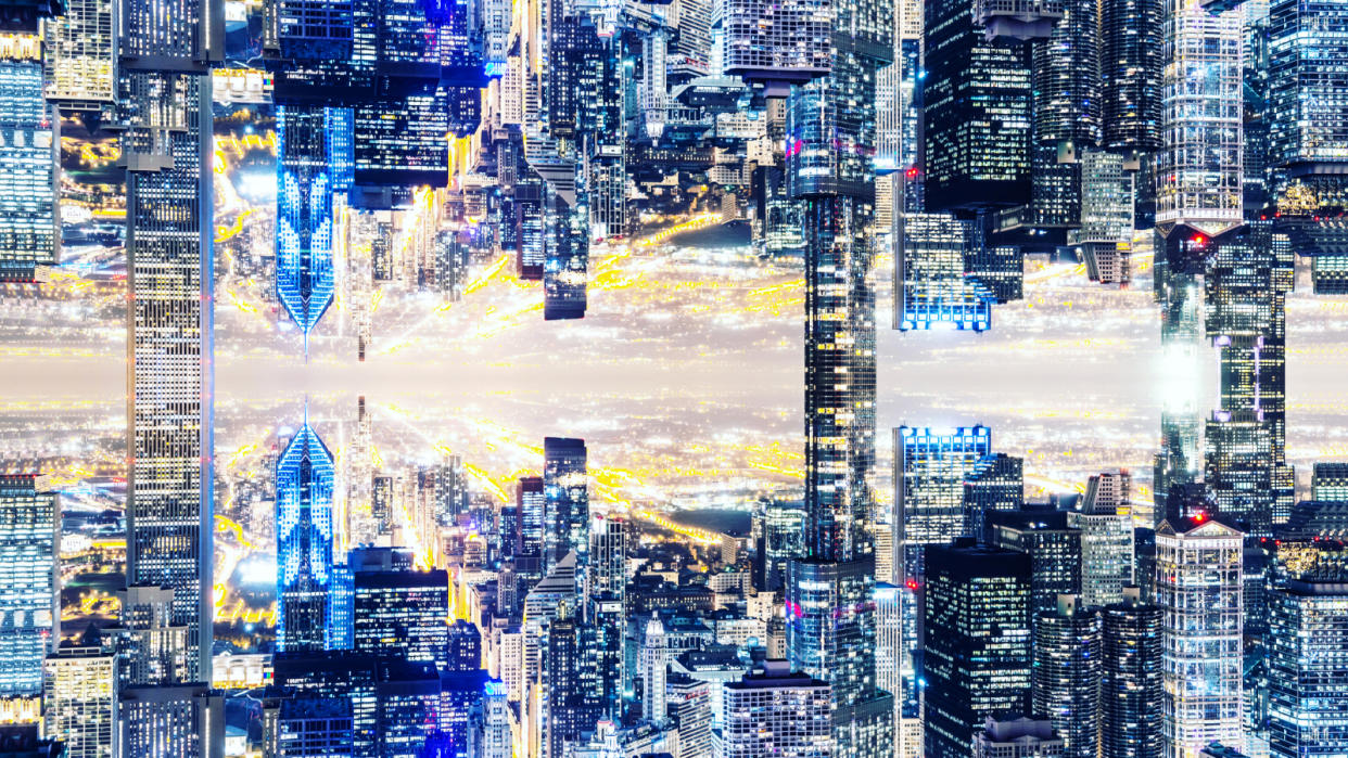  Image manipulation of the Chicago skyline with mirror effect, creating a new dimension with the city connecting upside down by the skyscrapers. 