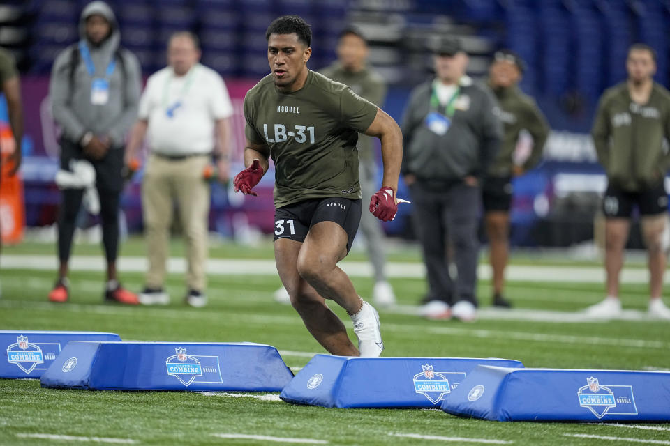 Alabama linebacker Henry To'Oto'O runs a drill at the NFL football scouting combine in Indianapolis, Thursday, March 2, 2023. (AP Photo/Darron Cummings)