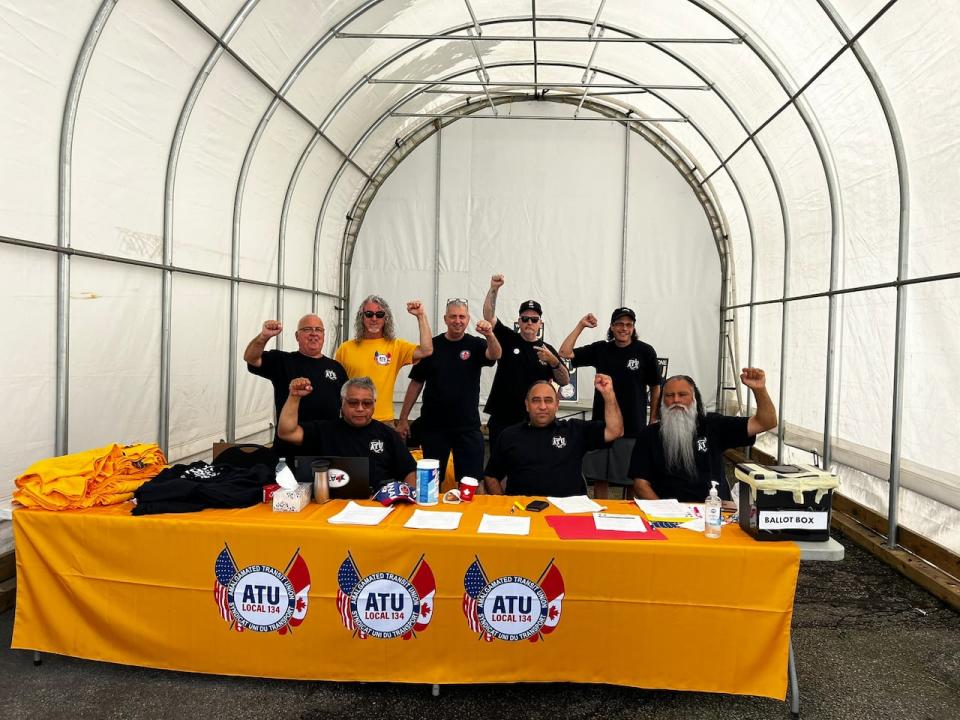 Negotiators from ATU Local 134 are seen celebrating after the union negotiated a tentative agreement with the District of West Vancouver earlier this week.