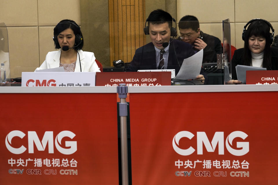 China's state broadcaster CCTV news broadcasters read news at a media center during a news conference on the eve of the annual legislature opening session in Beijing on March 4, 2021. Israel's Embassy in China is protesting what it describes as "blatant anti-Semitism" on a program run by the overseas channel of state broadcaster CCTV discussing the ongoing violence in Gaza and elsewhere. (AP Photo/Andy Wong)