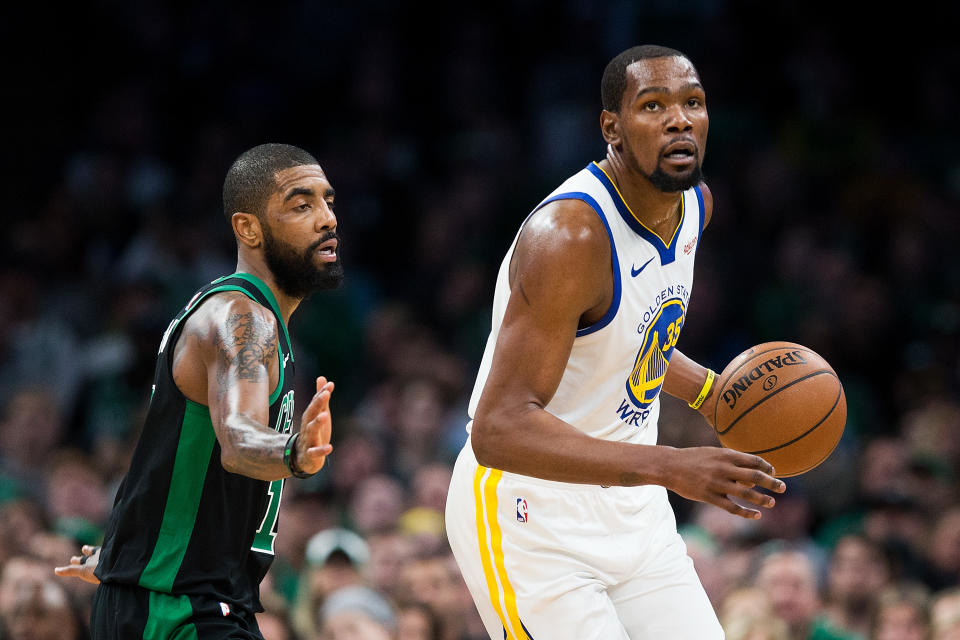 BOSTON, MA - JANUARY 26:  Kyrie Irving #11 of the Boston Celtics guards Kevin Durant #35 of the Golden State Warriors during a game at TD Garden on January 26, 2019 in Boston, Massachusetts. NOTE TO USER: User expressly acknowledges and agrees that, by downloading and or using this photograph, User is consenting to the terms and conditions of the Getty Images License Agreement. (Photo by Adam Glanzman/Getty Images)