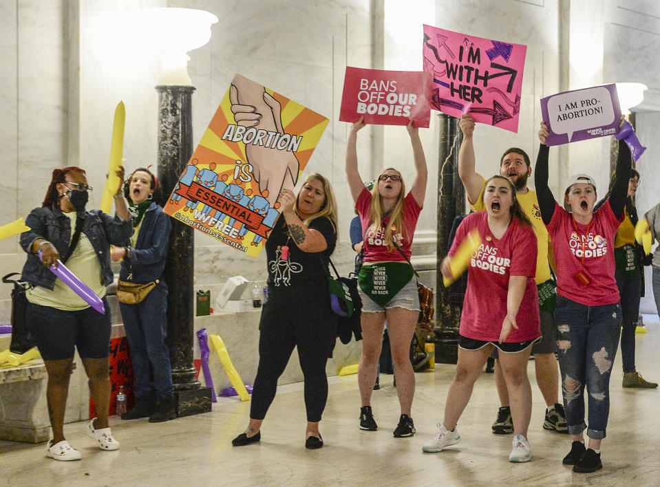 Abortion rights supporters demonstrate outside the Senate chamber at the West Virginia state Capitol on Tuesday, Sept. 13, 2022, in Charleston, W.Va., as lawmakers debated a sweeping bill to ban abortion in the state with few exceptions. (Chris Dorst/Charleston Gazette-Mail via AP)