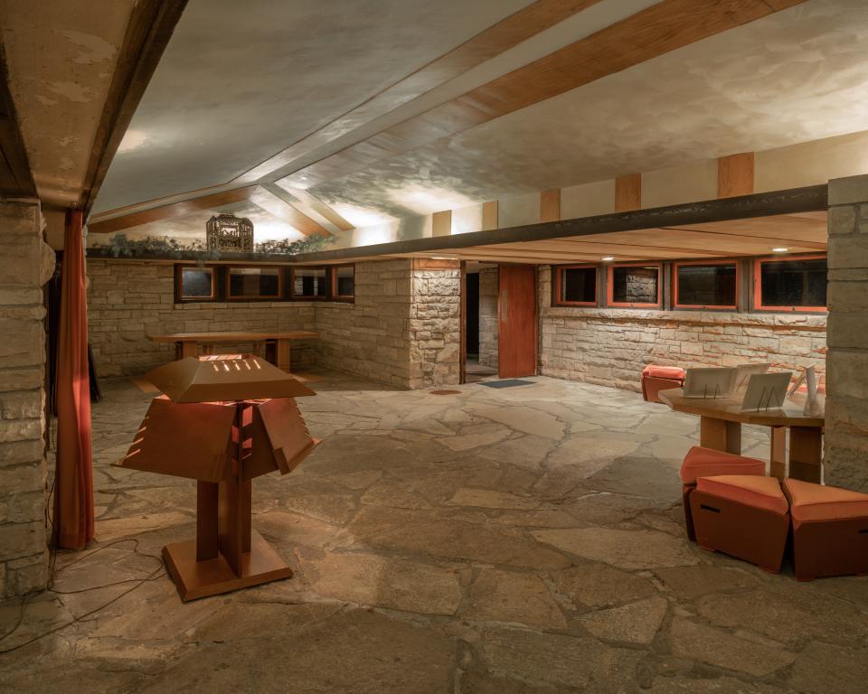 A gallery outside the theater is defined by stone, a material Wright used frequently throughout Taliesin.