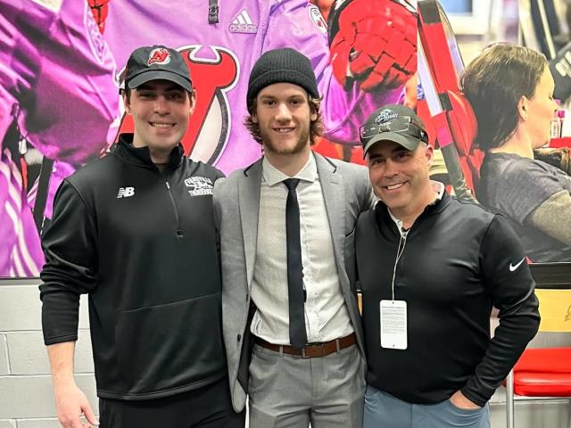 Dawson Mercer (centre) of the New Jersey Devils is pictured here with his uncle and longtime coach, Bo Bennett (right), and his cousin and longtime youth hockey teammate, Zach Bennett. The Bennetts were in New Jersey last month to watch Games 1 and 2 of the Devils-Rangers first round Stanley Cup playoff matchup. (Submitted by Zach Bennett - image credit)