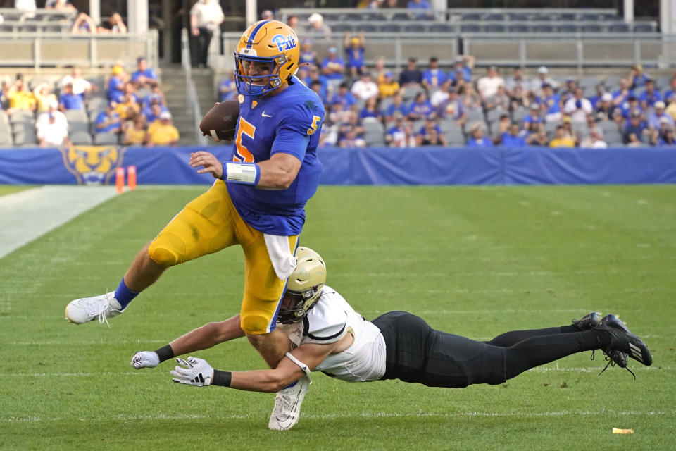 Pittsburgh quarterback Phil Jurkovec (5) is tackled by Wofford linebacker Nick Morgan during the second half of an NCAA college football game in Pittsburgh Saturday, Sept. 2, 2023. (AP Photo/Gene J. Puskar)