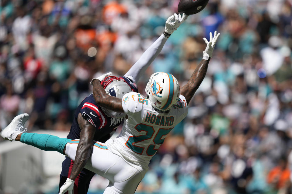 Miami Dolphins cornerback Xavien Howard (25) defends New England Patriots wide receiver DeVante Parker (1) during the second half of an NFL football game, Sunday, Sept. 11, 2022, in Miami Gardens, Fla. (AP Photo/Rebecca Blackwell)