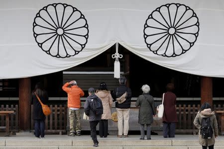 Visitors pray at the Yasukuni Shrine in Tokyo, Japan, December 29, 2016. REUTERS/Toru Hanai