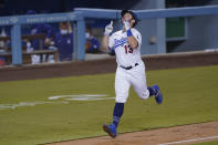 Los Angeles Dodgers' Max Muncy heads for home after hitting a two-run home run during the third inning of the team's baseball game against the Oakland Athletics Tuesday, Sept. 22, 2020, in Los Angeles. (AP Photo/Ashley Landis)