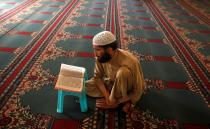 <p>A Muslim man prays as he prepares to break the fast on the first day of the holy month of Ramadan in Peshawar, Pakistan, May 27, 2017. (Fayaz Aziz/Reuters) </p>