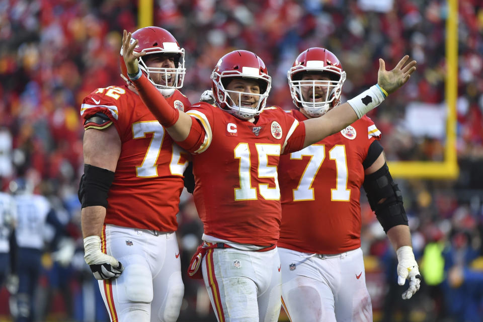 Kansas City Chiefs' Patrick Mahomes (15) celebrates a touchdown pass with Eric Fisher (72) and Mitchell Schwartz (71) during the second half of the NFL AFC Championship football game against the Tennessee Titans Sunday, Jan. 19, 2020, in Kansas City, MO. (AP Photo/Ed Zurga)