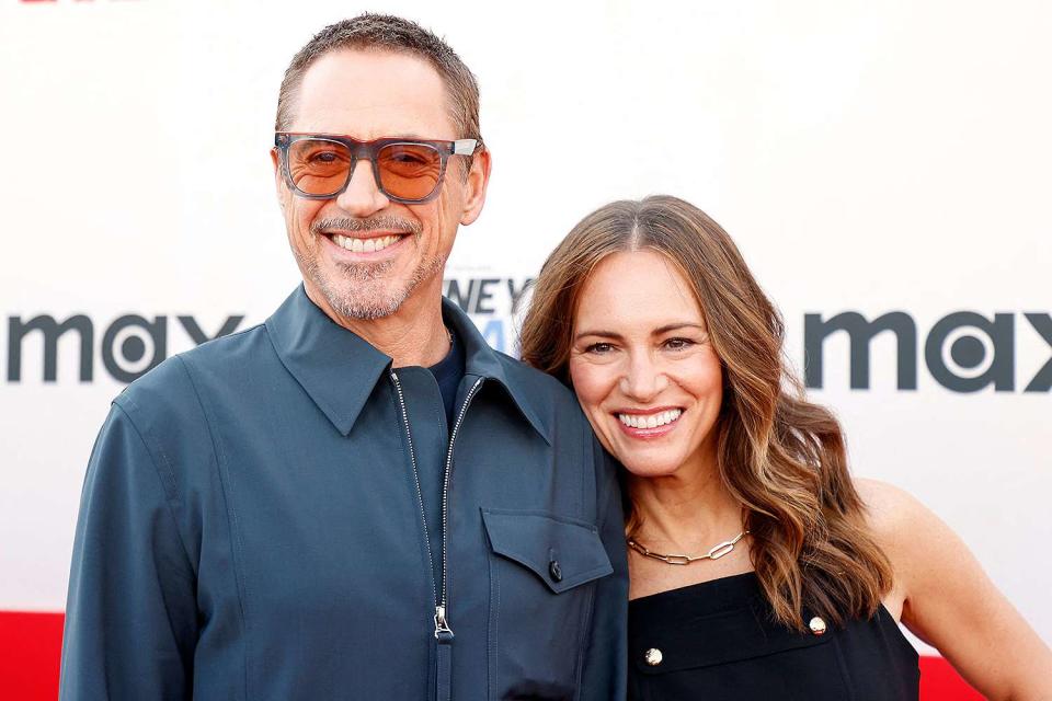 <p>MICHAEL TRAN/AFP via Getty </p> Robert Downey Jr. and wife Susan Downey