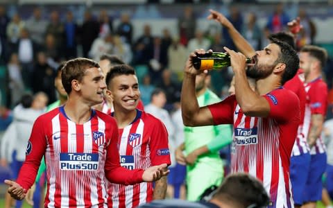 Atletico Madrid's Diego Costa and Antoine Griezmann celebrate after the match - Credit: Reuters