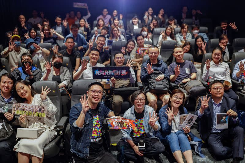 Director Ho Cheuk-Tin and actor Yeung Wai Lun pose with audiences after a private screening of Ho's movie "Over My Dead Body" in Hong Kong