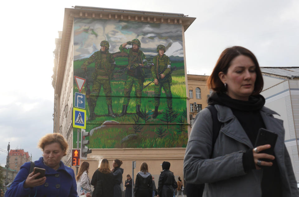 MOSCOW, RUSSIA - SEPTEMBER 22: (RUSSIA OUT)  A giant pro-war mural showing three soldiers in camouflage with weapons, emblazoned with the words 